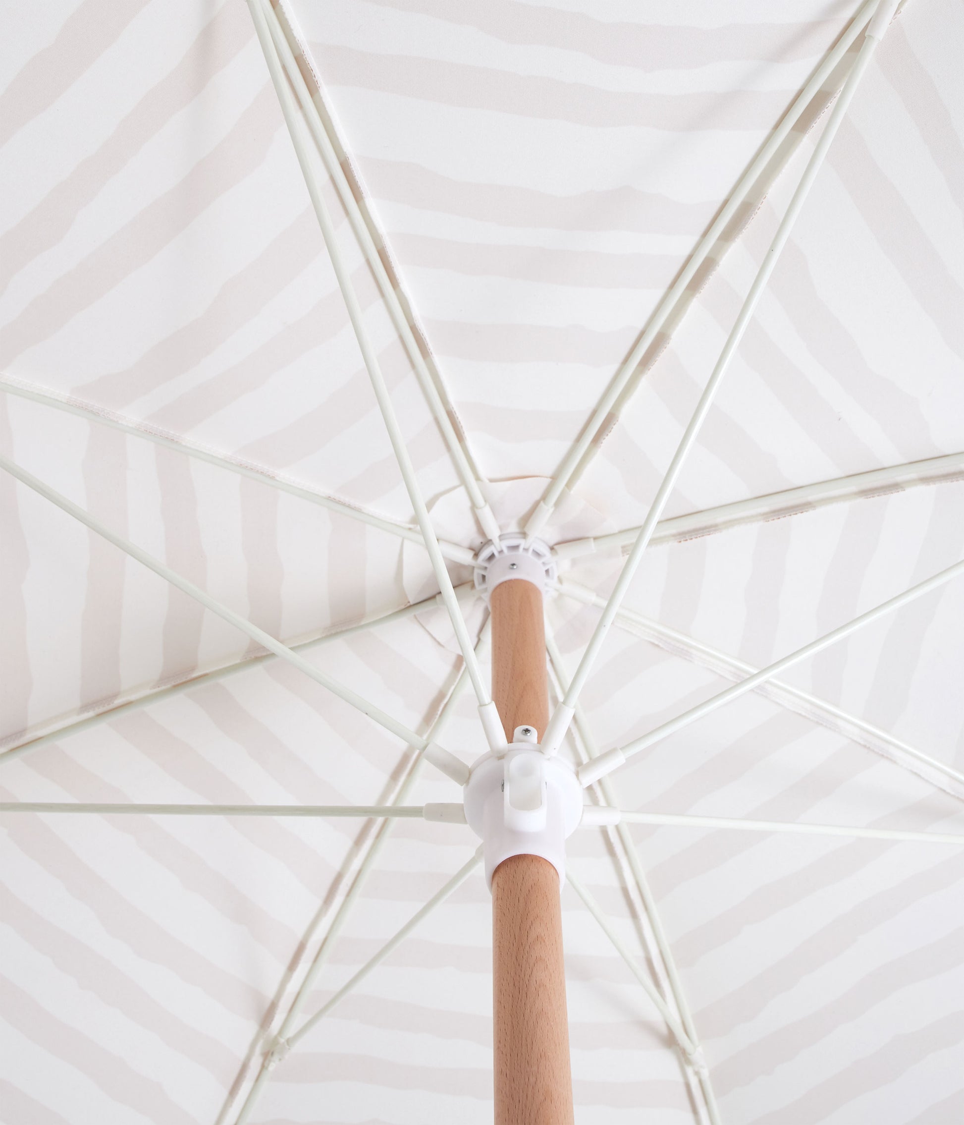 Sunday Supply Co Sun Ray beach umbrella open and seen from underneath.