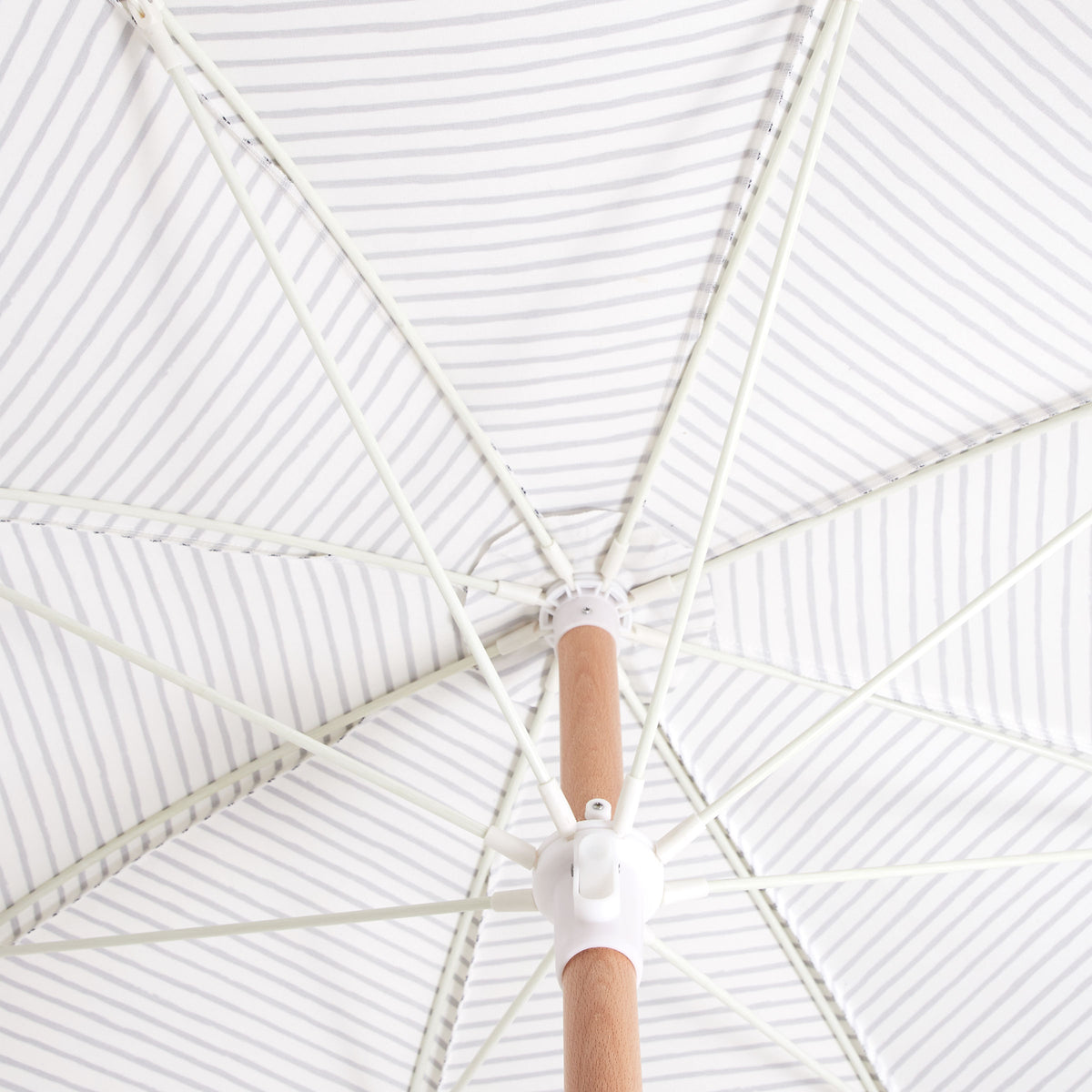 Sunday Supply Co Natural Instinct beach umbrella open and seen from underneath.